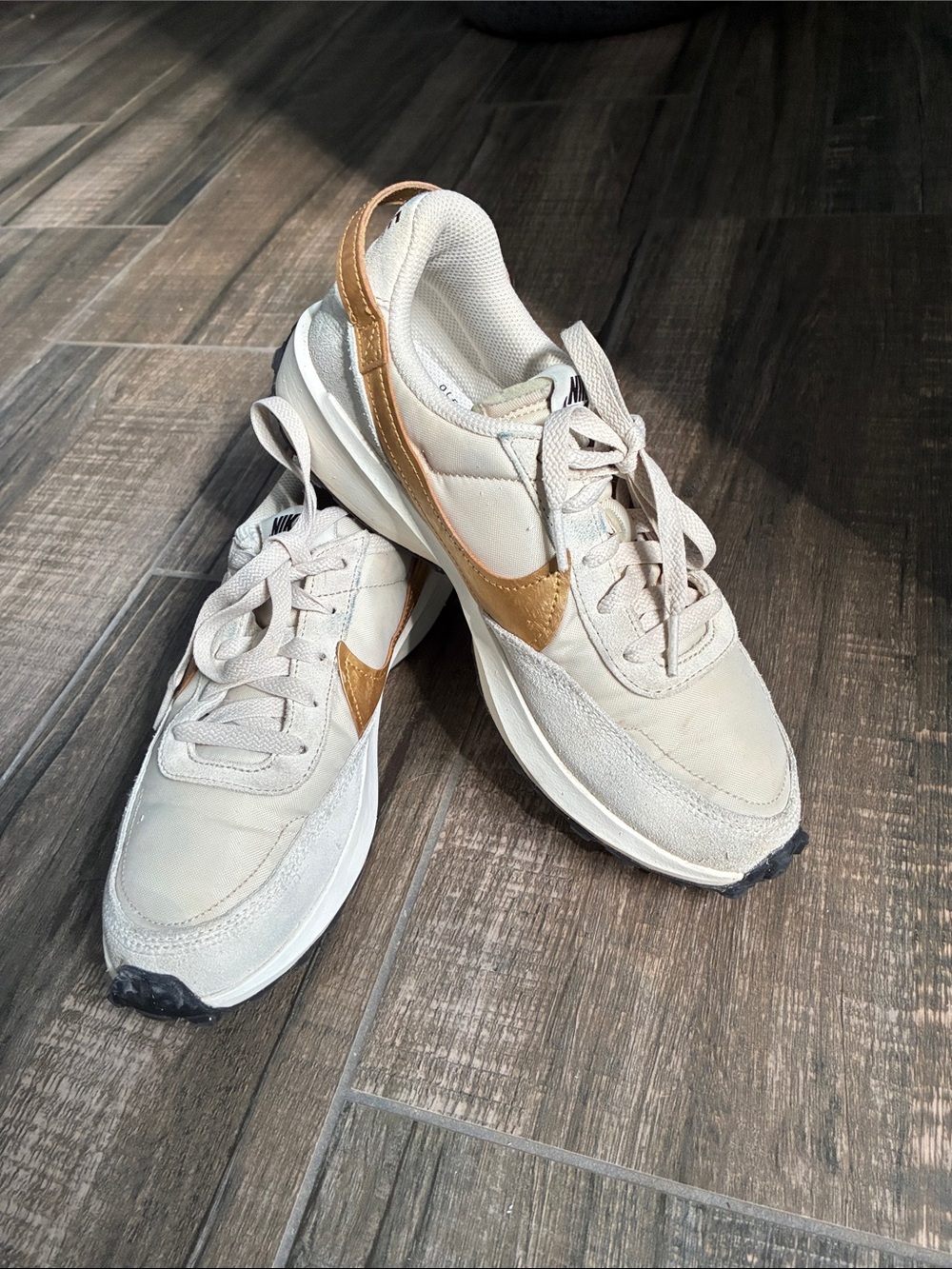 Nike Women’s Beige Sneakers with Gold Swoosh